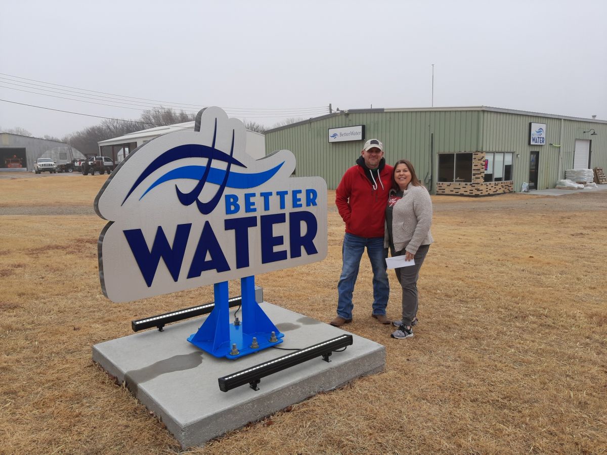 two people with a sign